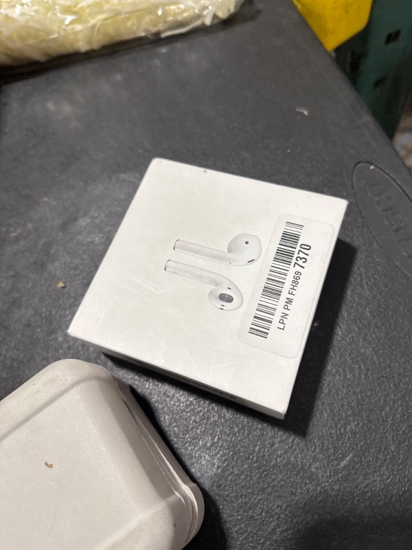 Photo 1 of Apple AirPods Wireless Ear Buds, Bluetooth Headphones with Lightning Charging Case Included, Over 24 Hours of Battery Life, Effortless Setup for iPhone