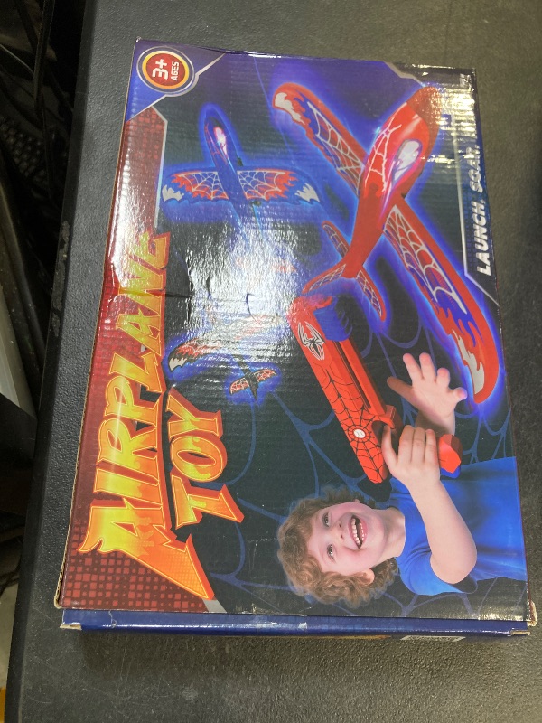 Photo 1 of 3 Pack Airplane Launcher Toy with Glowing Eyes & Web-Pattern Wings,2 Flight Modes Outdoor Games for Kids,Boys Toys Age 3-12,Birthday Gifts for 3 4 5 6 7 8 9 10 11 12 Year Old,Kids Gift(Red&Blue&Black)