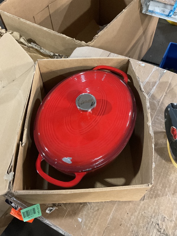 Photo 1 of *  lid has scuff marks, and pot has a crack on the handle *
Lodge 7 Quart Enameled Cast Iron Oval Dutch Oven with Lid – Dual Handles – Oven Safe up to 500° F or on Stovetop - Use to Marinate, Cook, Bake, Refrigerate and Serve – Red