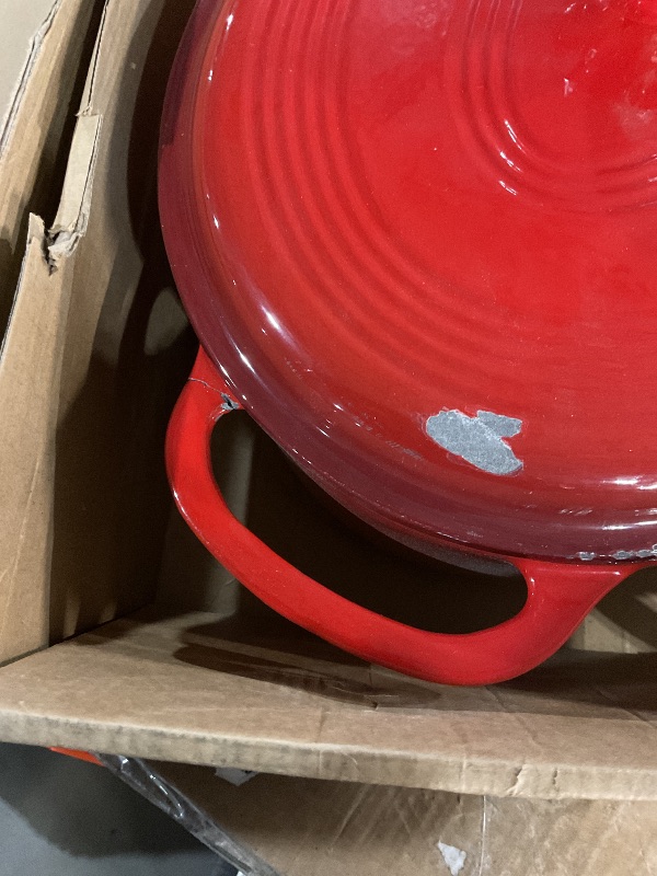 Photo 1 of *  lid has scuff marks, and pot has a crack on the handle *
Lodge 7 Quart Enameled Cast Iron Oval Dutch Oven with Lid – Dual Handles – Oven Safe up to 500° F or on Stovetop - Use to Marinate, Cook, Bake, Refrigerate and Serve – Red