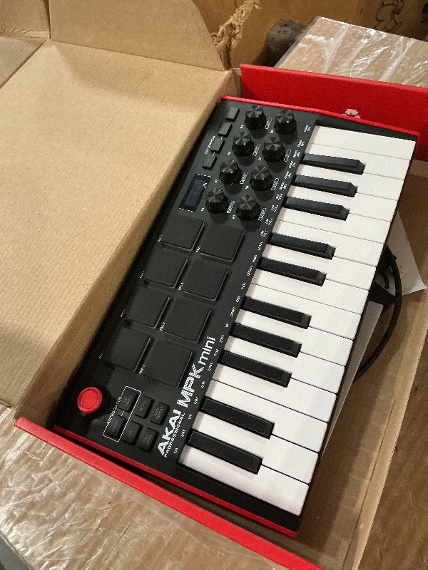 Photo 1 of Akai Professional MPK Mini MK3-25 Key USB MIDI Keyboard Controller With 8 Backlit Drum Pads, 8 Knobs, Music Production Software and Native Instruments Sound Package (NKS Integration)