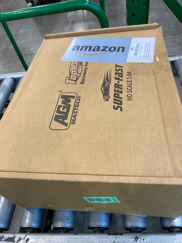 Photo 1 of *MISSING PARTS*
AGM MASETCH High Speed Series Tram Dual Track Set, Track with 4 Vehicles Official Licensed Slot car Racing, Comes with 2 Hand Controls and Track Parts and a Lap Counter.