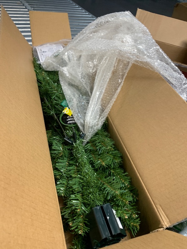 Photo 1 of National Tree Company Pre-Lit Artificial Medium Christmas Tree, Green, Kincaid Spruce, Multicolor Lights, Includes Stand, 4 Feet