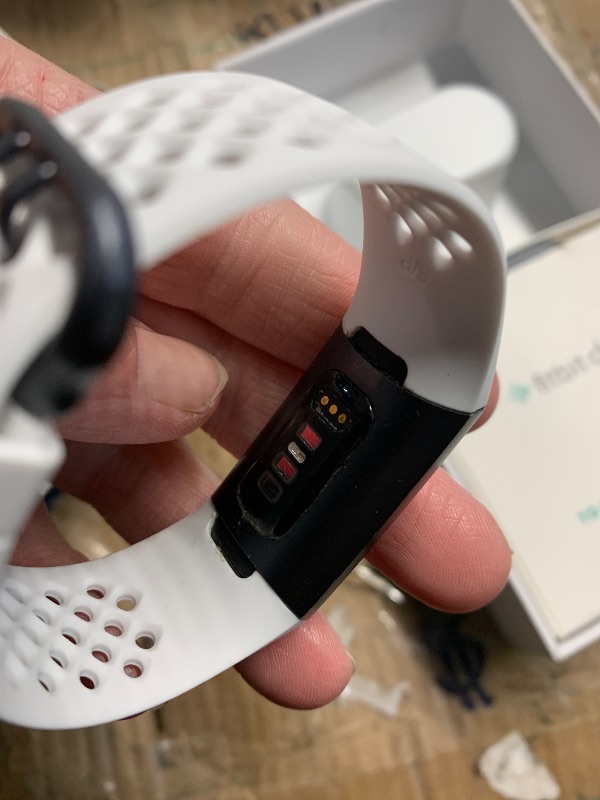 Photo 1 of ***(HEAVILY USED/ MINOR DAMAGE)***Fitbit Charge 3 SE Fitness Activity Tracker Graphite/White Silicone, One Size (S and L Bands Included),1 Count (Pack of 1)