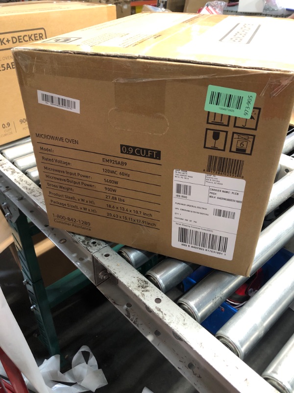 Photo 1 of ***FACTORY SEALED*** BLACK+DECKER Digital Microwave Oven with Turntable Push-Button Door, Child Safety Lock, Stainless Steel, 0.9 Cu Ft