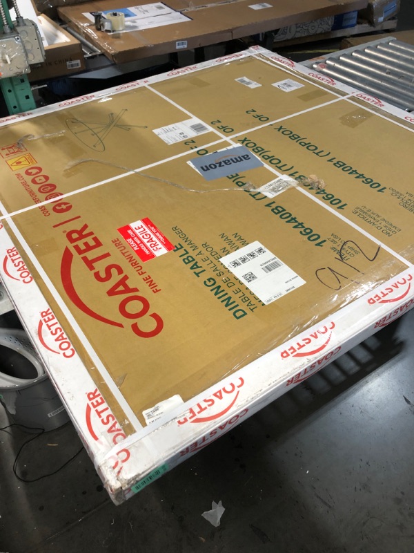 Photo 1 of **Box 1 of 2** Coaster Home Furnishings Beckham 46" Round Dining Table with Glass Top and Asterisk Metal Base, Sculptural Modern Glass Dining Table for Kitchens, Chrome