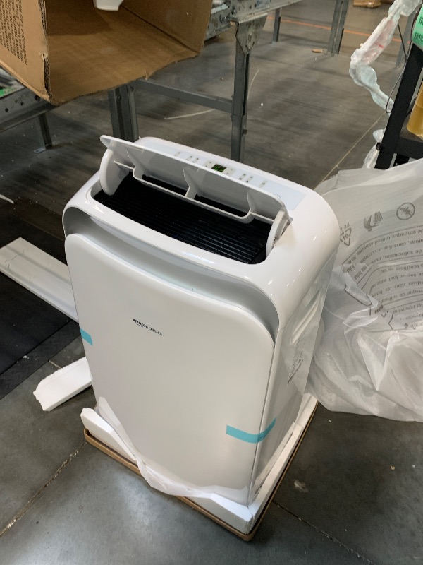 Photo 1 of *********TURNS ON PERFECTLY******* Amazon Basics 4-In-1 Portable Air Conditioner, 13500 BTU (ASHRAE), Cools Up to 550 Sqf, Portable AC with Cool/Heat/Dry (Dehumidifier)/Fan-Only Functions, Auto Mode, Sleep Mode, Timer, White