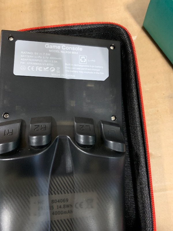 Photo 1 of ?R36MAX 4000mAh Portable Rechargeable Handheld Retro Game Console,Comfort Non-Slip Handheld Standing Retro Game Console with 64G TF Car,4.0-inch Screen,for Office,Black