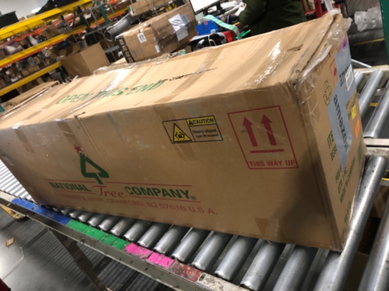 Photo 1 of ** used ** National Tree Company 6 ft Pre-Lit Dunhill Fir Artificial Christmas Tree, 600 Clear Lights, 1,430 Tips, Includes Stand, Green