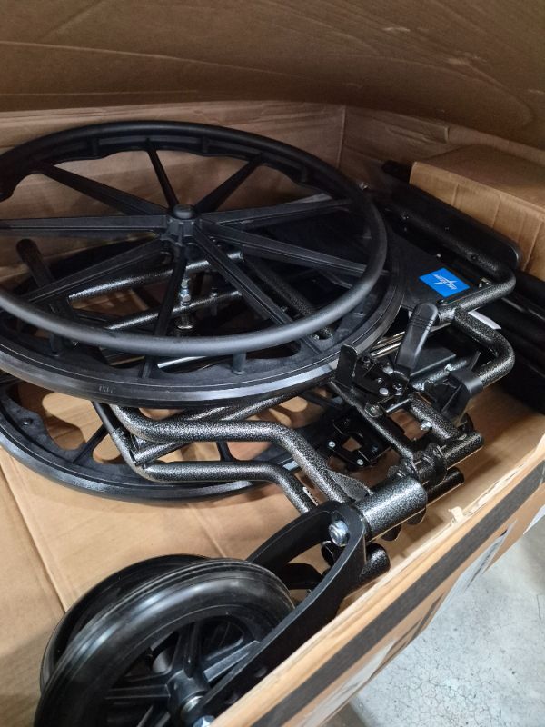 Photo 1 of ***********DAMAGE TO ONE OF THE BIG WHEELS***************
Medline Durable Steel Wheelchair with Flip-Back Desk-Length Arms, Elevated Leg Rests, 20-Inch Wide Seat, 300-Ib weight capacity, 50.2 Pounds, Black