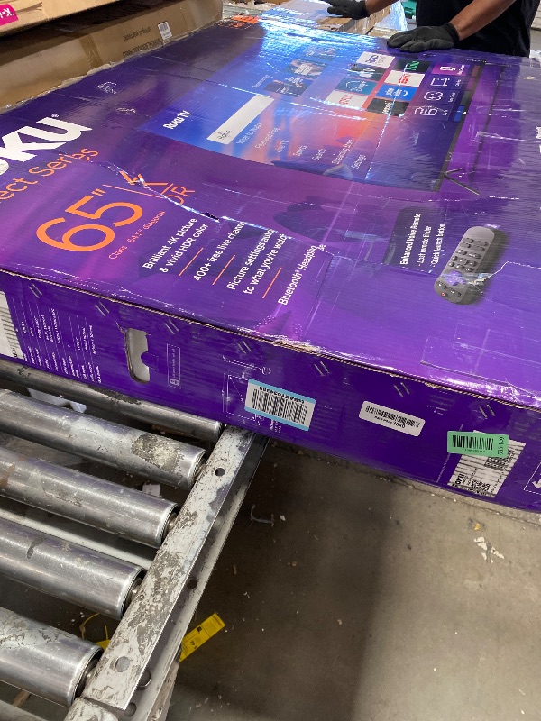 Photo 1 of **SCREEN HEAVILY DAMAGED, PARTS ONLY**Roku Smart TV 2025 – 65-Inch Select Series, 4K HDR TV – RokuTV with Enhanced Voice Remote – Flat Screen LED Television with Wi-Fi for Streaming Live Local News, Sports, Family Entertainment
