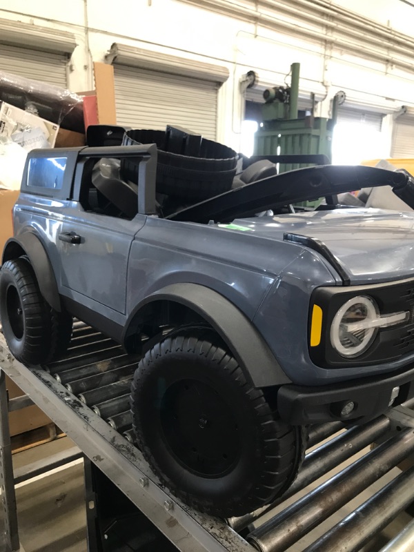 Photo 1 of **PARTS ONLY/SEE NOTES** Kid Trax 12V Ford Bronco Ride-On Toy for Ages 3-7, Battery Powered, LED Headlights, FM Radio, MP3, Horn, 2-Seater, Max Weight 130 lb, 2 Speeds, Electric Car for Kids, Kids Ride on Toys, No Remote