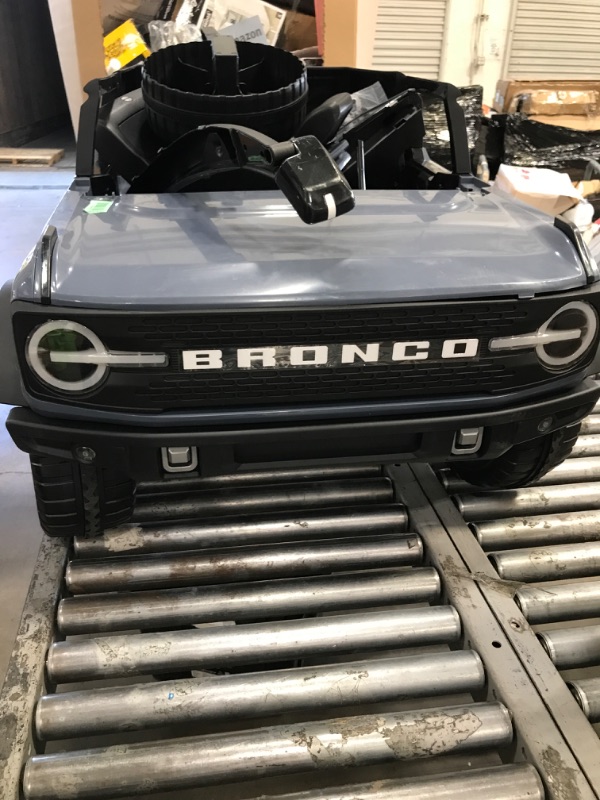 Photo 1 of **PARTS ONLY/SEE NOTES** Kid Trax 12V Ford Bronco Ride-On Toy for Ages 3-7, Battery Powered, LED Headlights, FM Radio, MP3, Horn, 2-Seater, Max Weight 130 lb, 2 Speeds, Electric Car for Kids, Kids Ride on Toys, No Remote