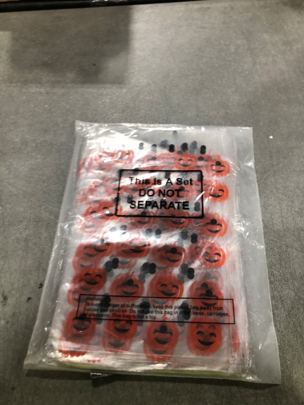 Photo 1 of 100 Sets Halloween Pumpkin Print Cone Cellophane Bags Heat Sealable Halloween Treat Candy Gift Bags and Golden Twist Ties for Treat Party Favor