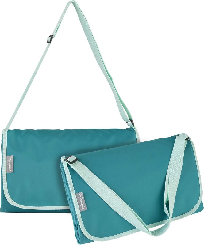 Photo 1 of ***STOCK PHOTO IS NOT EXACT. SIMILAR ITEM. DIFFERENT COLOR***
LIGHTSPEED OUTDOORS XL FOLDING BLANKET. DARK BLUE WITH LIGHT BLUE TRIM