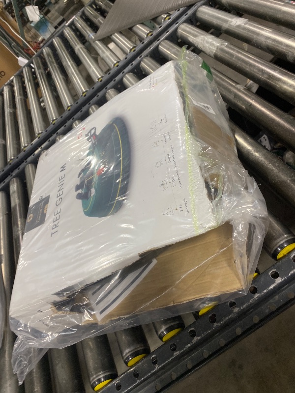 Photo 1 of Krinner Christmas Tree Genie Medium - Green Tree Stand - Original Single Cable Operation, Holds up to 7 ft Live Trees - Foot Pedal Setup & Water Reservoir with Level Indicator - German Made