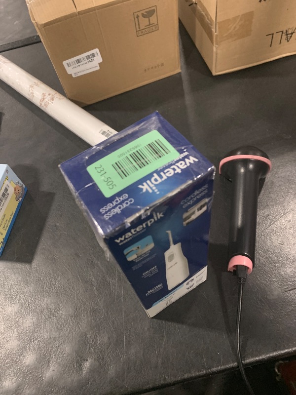 Photo 1 of Waterpik Cordless Express Water Flosser, Battery Operated & Portable for Travel & Home, ADA Accepted, Waterproof for Shower Use, White WF-02, Packaging May Vary