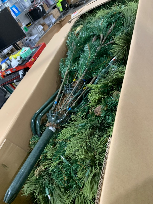 Photo 1 of National Tree Company 7.5 ft Pre-Lit Carolina Pine Artificial Christmas Tree, 750 Clear Lights, 1,399 Tips, Includes Stand, Green