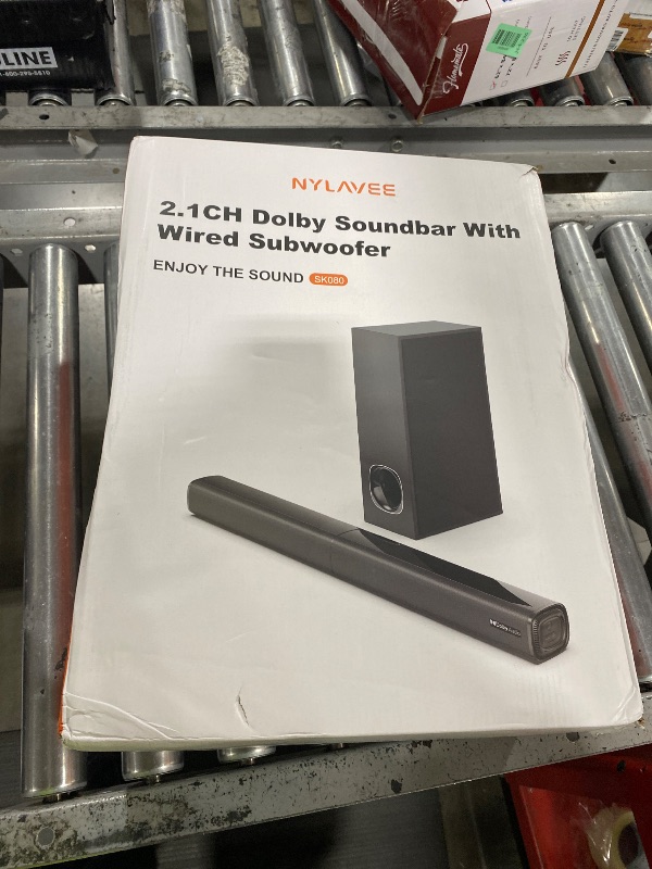 Photo 1 of *****NONFUNCTIONAL FOR PARTS ONLY****** Nylavee Sound Bar - 2.1ch Dolby Audio Soundbar with Subwoofer, 240W High Volume, Wall Mountable 30-inch Bluetooth Sound Bar with HDMI ARC, Optical, and AUX Connection for TV, Projector, Computer