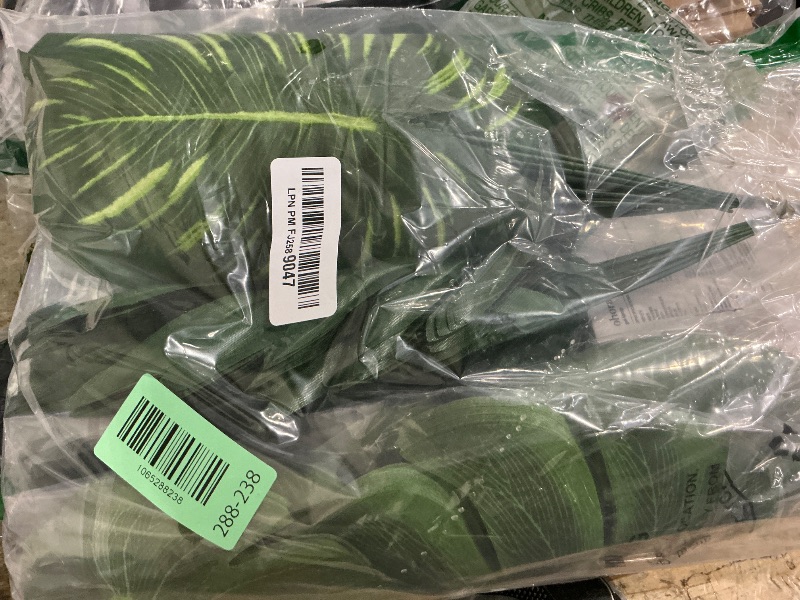 Photo 1 of 108 Pieces 7 Kinds Artificial Tropical Leaf Jungle Leaves Plant Safari Leaves Decorations Fake Palm Leaf with Stems for Hawaiian Luau Party Table Beach Birthday Wedding Theme Party Decorations