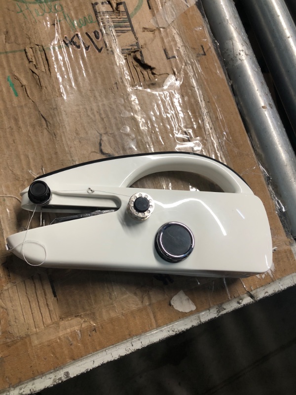 Photo 1 of ***(MISSING ACCESSORIES)***Handheld Sewing Machine,Two dear,Mini sewing machine,Easy to Use and Fast Stitch Suitable for Clothes,Fabrics, Handheld Sewing Machine for Beginners.Black white