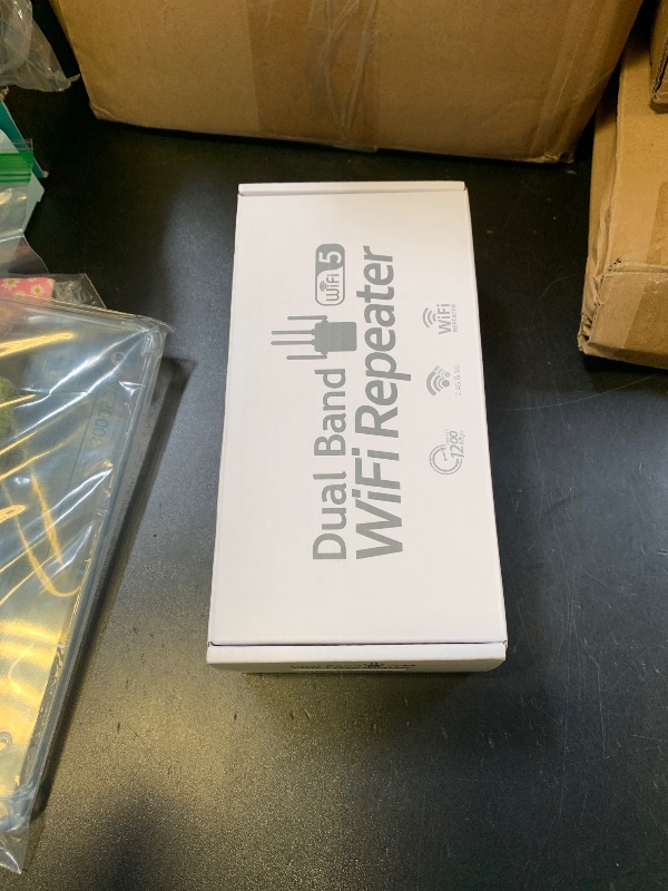 Photo 1 of WiFi Extender Signal Booster,Up to 12880 Sq.ft and 105 Devices, 1200Mbps Dual-Band Speed,1 Ethernet Port,Easy Set up