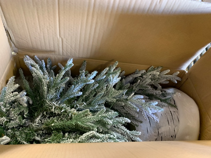 Photo 1 of Puleo International 4.5ft Pre-Lit Potted Flocked Arctic Fir Christmas Tree with 70 Clear Lights, 419 Realistic Dense Snow Flocked Branch Tips, Easy Setup Artificial Trees with Sturdy Stand