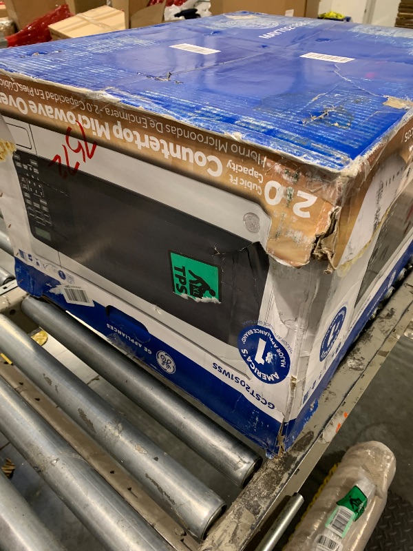 Photo 1 of * Damaged USED FOR PARTS***GE Countertop Microwave Oven,1, 200-watt Capacity, 2.0 Cubic Ft., 8 Auto Setting Cooking Settings, Child-Lock Technology, Kitchen Essentials for the Countertop, Dorm Room or Apartment, Stainless Steel