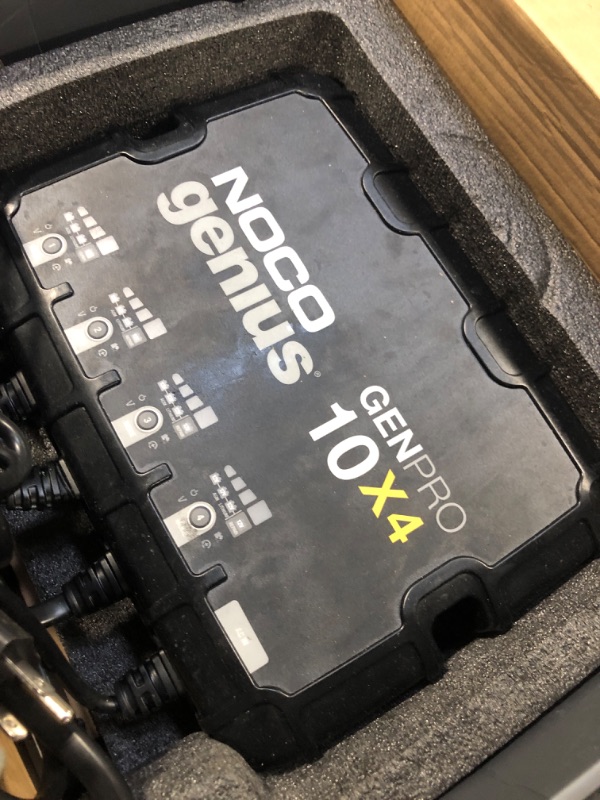 Photo 1 of ***MAJOR DAMAGE*** NOCO Genius GENPRO10X4: 4-Bank, 40A Onboard Battery Charger - 10A Per Bank, 12V Waterproof Marine Charger with Overcharge Protection & Temperature Compensation – for Lead-Acid & Lithium Batteries