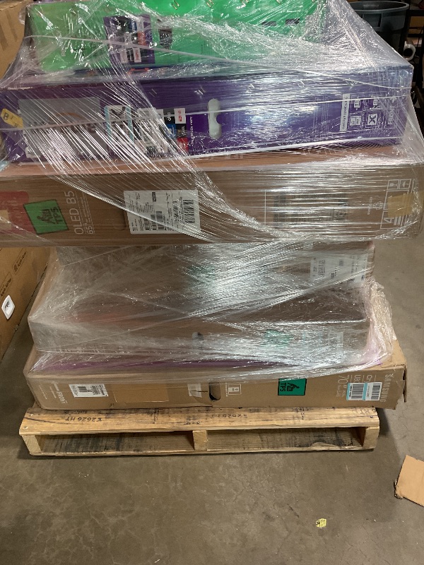 Photo 1 of **FINAL SALE. NO RETURNS. WILL NEED A TRUCK FOR PICKUP. SELLING FOR PARTS** One pallet of 7 broken tvs. 