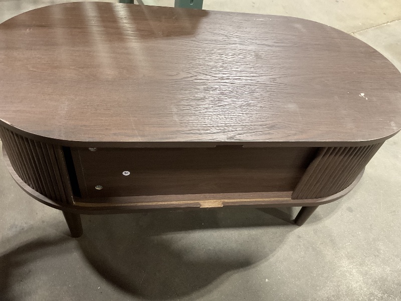 Photo 1 of **DOORS ARE STUCK.MDIRT.MSCRAPES**LINSY HOME Oval Coffee Table, Wood Coffee Table with Storage, Fluted Accent Center Table with Sliding Tambour Door, 39" Mid Century Modern Coffee Tables for Living Room, Bedroom, Apartment, Walnut