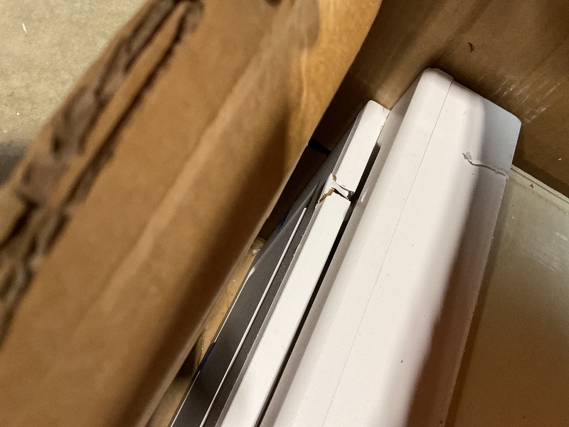 Photo 1 of **TORN AT HINGES**Household Essentials Stowaway in-Wall Ironing Board Finish: White
