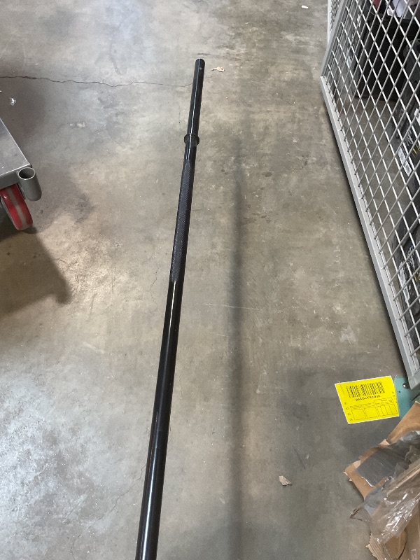 Photo 1 of **SCRAPE DAMAGE ON END**6ft black barbell