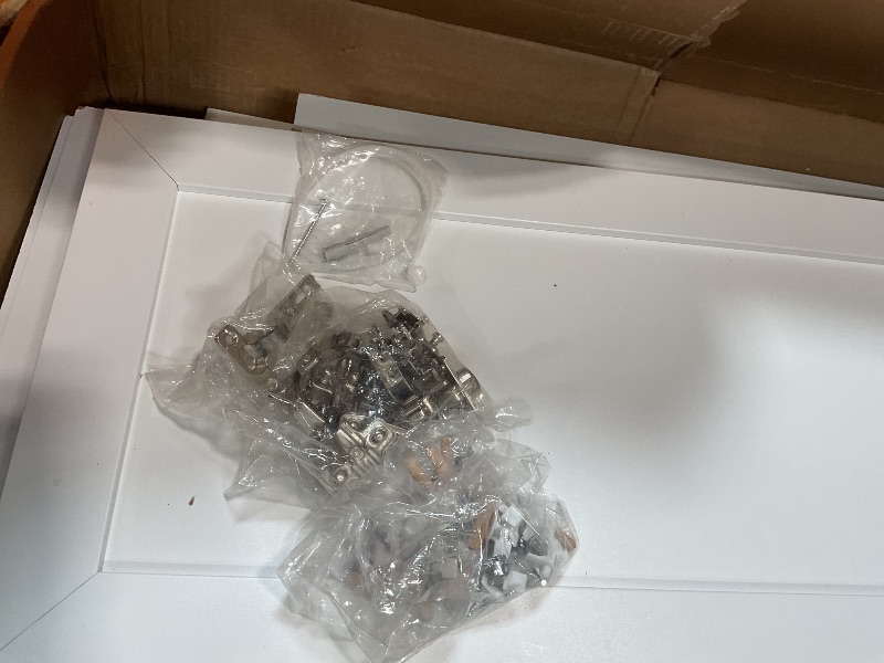 Photo 1 of **CHIP DAMAGE. **White cabinet