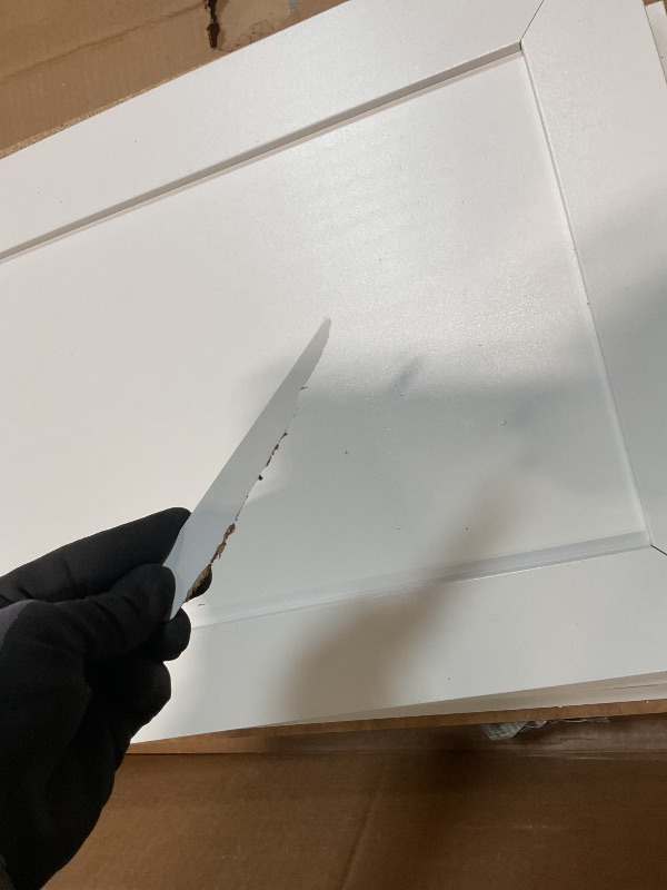 Photo 1 of **CHIP DAMAGE. **White cabinet