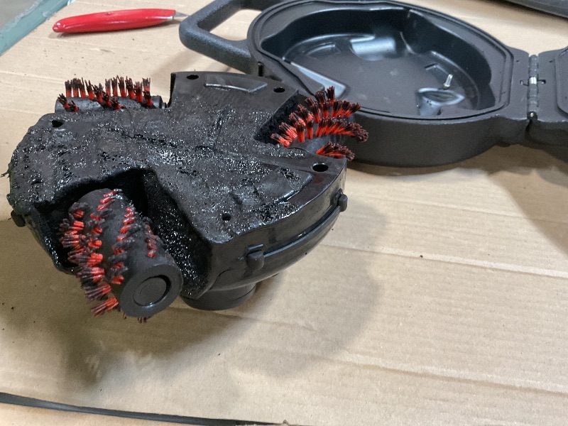 Photo 1 of **BURN DAMGE. MISSING CHARGER. SELLING FOR PARTS**Grillbot Automatic Grill Cleaning Robot with Nylon Brushes, BBQ Grill Cleaner, Grill Brush, Grill Scraper, BBQ Accessories (Black Grillbot + Carry Case)