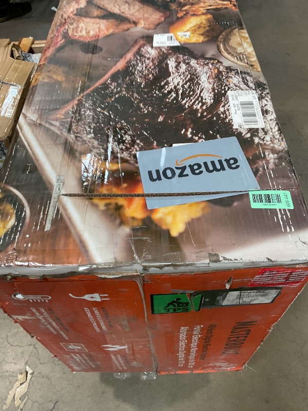 Photo 1 of **FOR PARTS ONLY/ UNIT BADILY DENTED *** Masterbuilt® 40-inch Digital Electric Vertical BBQ Smoker with Leg Kit, Side Wood Chip Loader and 970 Cooking Square Inches in Black, Model MB20070122