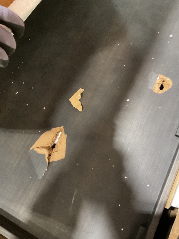 Photo 1 of **2 HOLES DAMAGE**Signature Design by Ashley Johnelle Farmhouse Coffee Table with Weathered Gray Finish, Gray