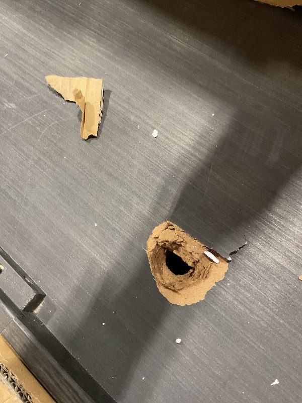 Photo 1 of **2 HOLES DAMAGE**Signature Design by Ashley Johnelle Farmhouse Coffee Table with Weathered Gray Finish, Gray