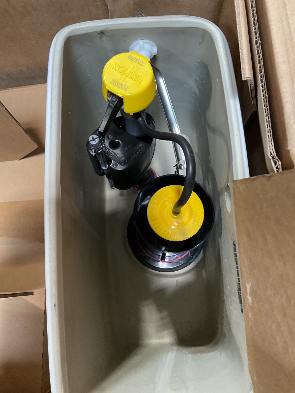 Photo 1 of *** MAJOR DAMAGE/SEE PHOTOS ***KOHLER 78080-0 Reach Comfort Height Chair Height One-Piece Compact Elongated Toilet with Skirted Trapway, Left-Hand Trip Lever, 1.28 GPF