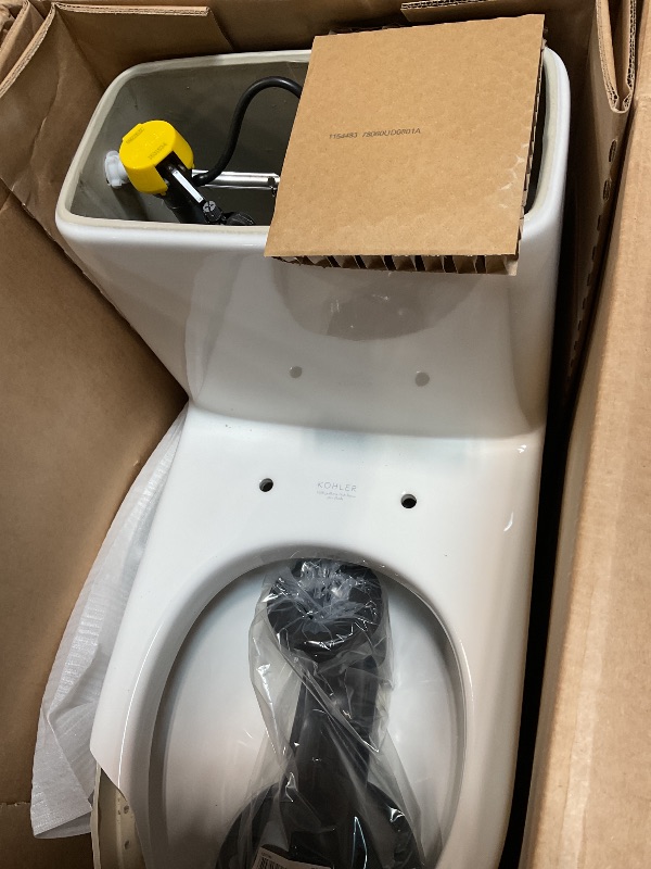 Photo 1 of *** MAJOR DAMAGE/SEE PHOTOS ***KOHLER 78080-0 Reach Comfort Height Chair Height One-Piece Compact Elongated Toilet with Skirted Trapway, Left-Hand Trip Lever, 1.28 GPF
