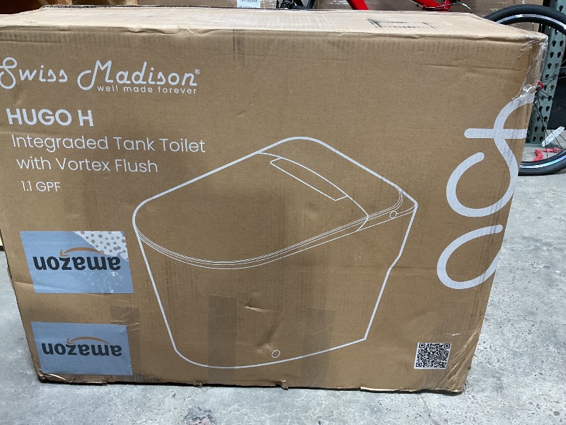Photo 1 of *** MAJOR DAMAGE***Swiss Madison Hugo Power Flush Tankless Toilet 12" Rough-in 1.1 GPF Non-Electric ADA Toilet with Integrated Tank in Glossy White