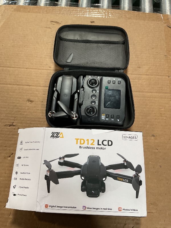 Photo 1 of *** FOR PARTS ONLY/ HAS A BROKEN BACK BLADE /EVERYTHING POWERS ON BUT DRONE BLADES WONT MOVE AT ALL*** Toladrone TD12LCD Drone with LCD Screen Remote Control Brushless Motor WiFi Real-time Transmission Drones for Adults Drone with Camera Foldable Quadcopt