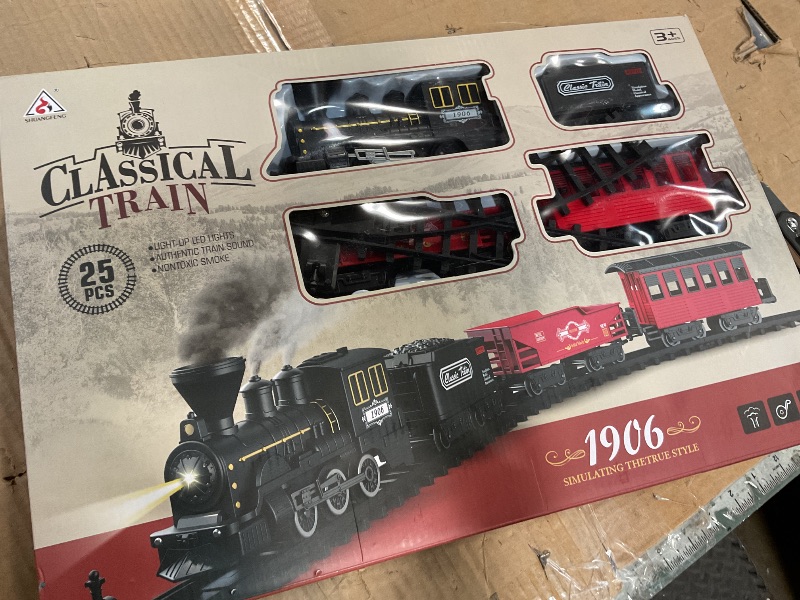 Photo 1 of **HAS DAMAGED PIECES** 25-Piece Christmas Train Set with Smoke, Sound & Lights - Fancy Track & Vintage Passenger Carriages for Christmas, Steam Kids Train Set Around Christmas Tree for Kids Ages 3-8 Years Old Boys Gifts