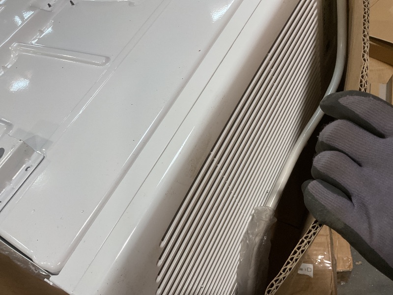 Photo 1 of **SCRAPES. DIRT**Keystone 12,000 BTU Window Air Conditioner with 11,000 BTU Supplemental Heating and Dehumidification, 230V, Window AC Unit for Living Room, Apartment, Medium Sized Rooms up to 550 Sq.Ft.