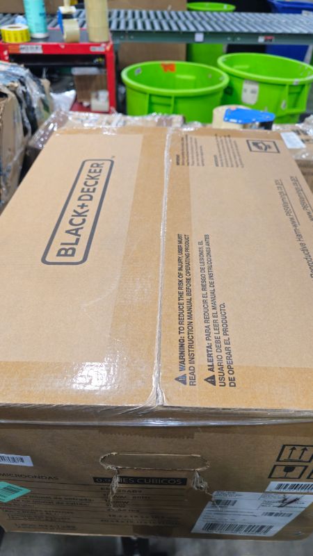 Photo 1 of ****FACTORY SEALED***BLACK+DECKER Digital Microwave Oven with Turntable Push-Button Door, Child Safety Lock, Stainless Steel, 0.9 Cu Ft