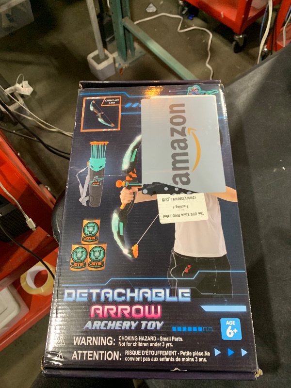 Photo 1 of JOYIN Kids Bow and Arrow Set, LED Light Up Archery Toy Set with 9 Suction Cup Arrows, Target & Arrow Case, Indoor and Outdoor Hunting Play Gift Toys for Kids, Boys & Girls Ages 6-12