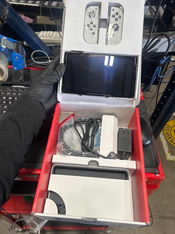 Photo 1 of ****PARTS ONLY****
***DAMAGED - SEE NOTES/PICTURES***
Nintendo Switch – OLED Model w/White Joy-Con