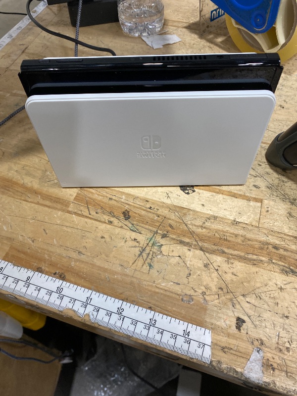 Photo 1 of ****PARTS ONLY****
***DAMAGED - SEE NOTES/PICTURES***
Nintendo Switch – OLED Model w/White Joy-Con