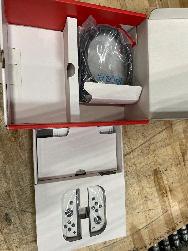 Photo 1 of ****PARTS ONLY****
***DAMAGED - SEE NOTES/PICTURES***
Nintendo Switch – OLED Model w/White Joy-Con